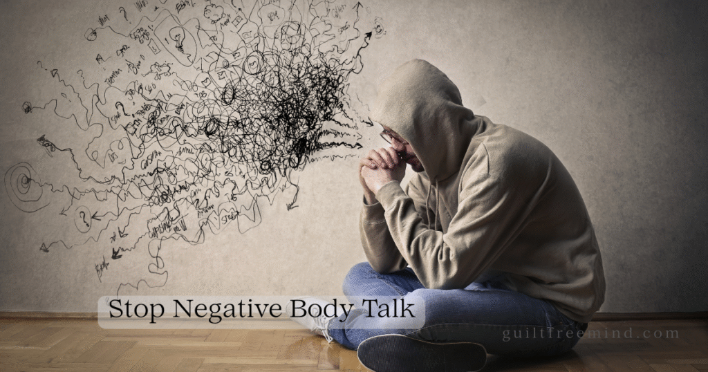 A person in a hoodie sits on the floor looking overwhelmed as chaotic scribbled thoughts burst from their head, overlay text reads “Stop Negative Body Talk” – visualizing the struggle with negative body talk during swimsuit season and the need for compassionate self-talk scripts.
